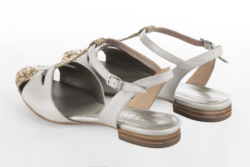 Gold and pure white women's open back T-strap shoes. Round toe. Flat leather soles. Rear view - Florence KOOIJMAN